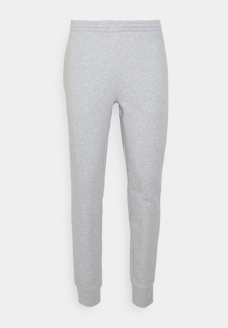 Pantaloni de trening gri din bumbac, cu picior tapered, talie elastică și mansete cu nervuri. Design minimalist, fără motive sau accente distincte.