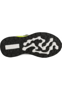 Semelle de chaussure en caoutchouc noir avec un motif de grip texturé et des accents blancs. Comprend une découpe rectangulaire pour la structure.