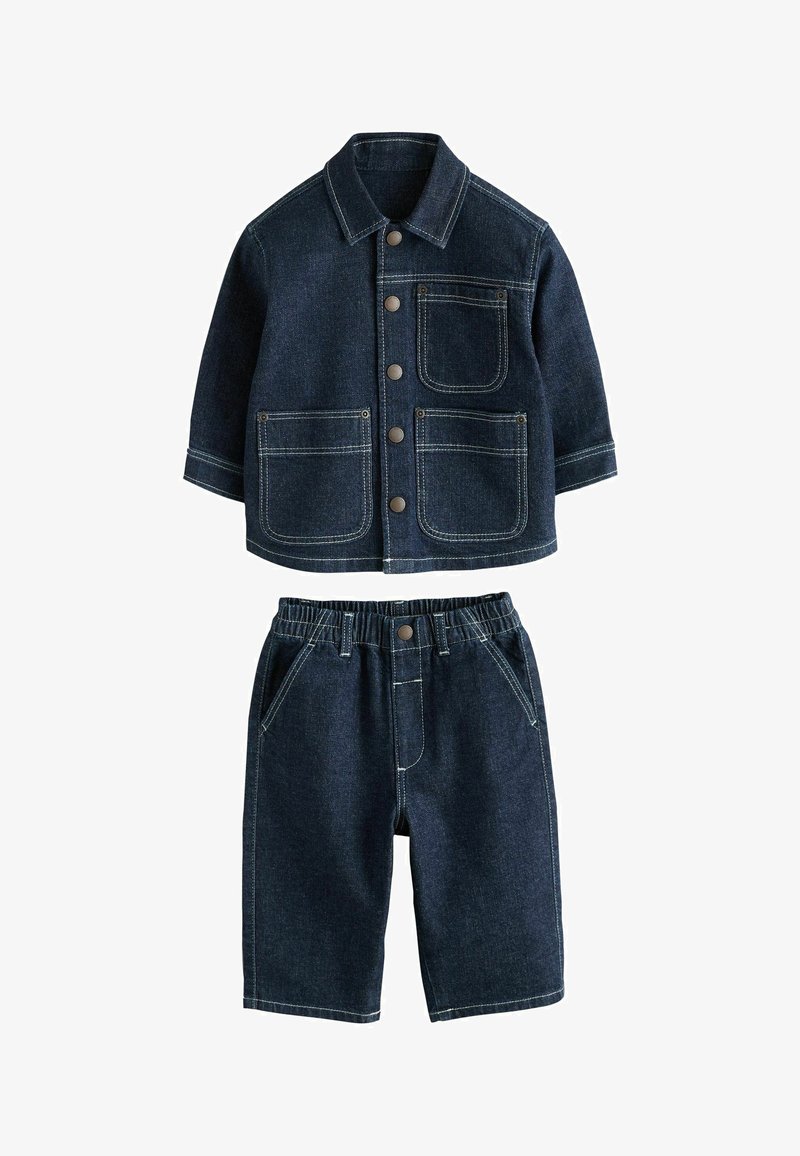 Dark blue denim jacket with front buttons and three pockets paired with matching elastic waist denim shorts.