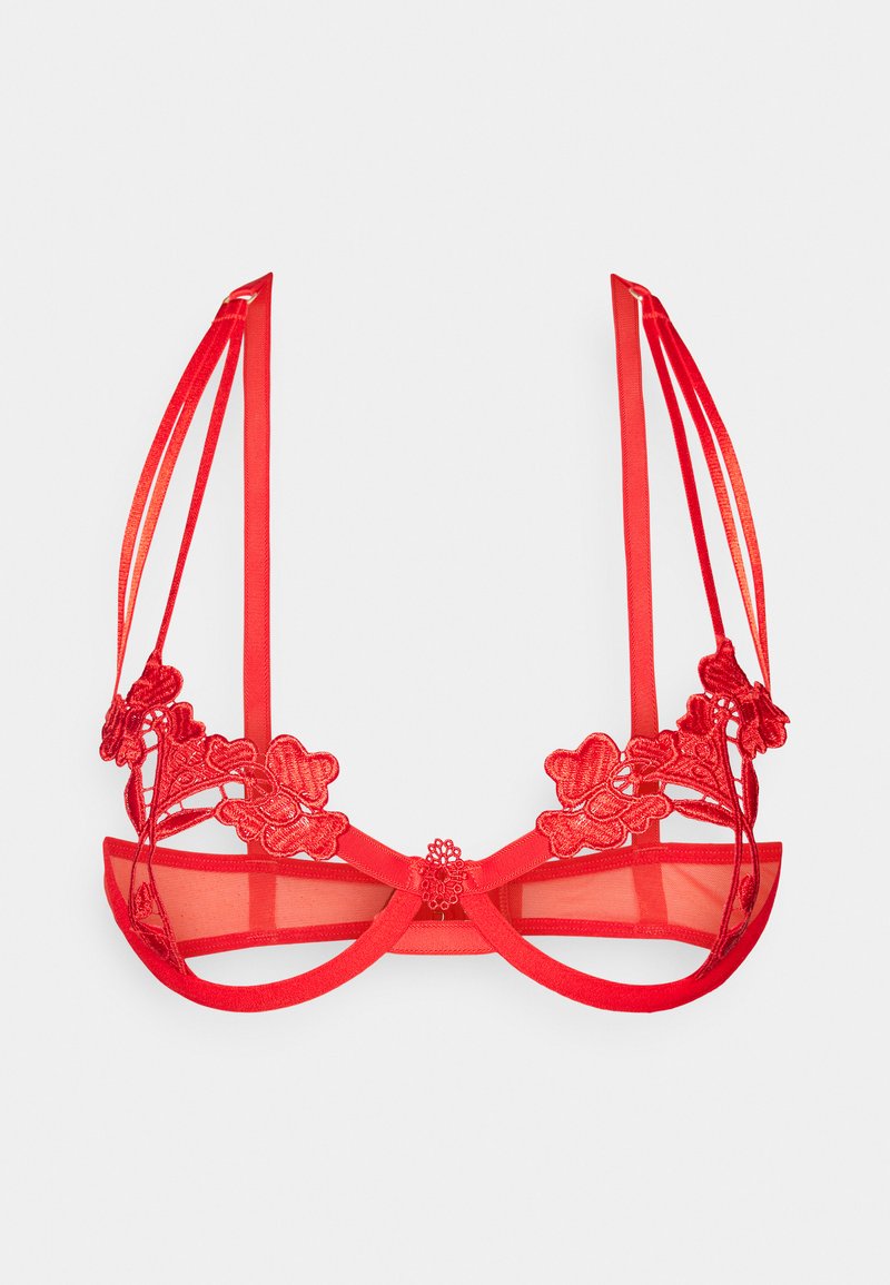 Red bra featuring floral lace detailing, sheer mesh cups, and satin straps. Center bow accent with adjustable straps and hook closure.
