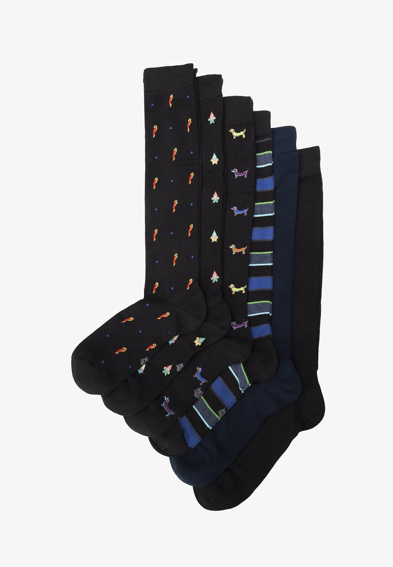 Set aus sieben knielangen, schwarzen Socken mit verschiedenen Mustern, darunter bunte Paprika, festliche Bäume und Streifen. Hergestellt aus weichem Stoff.