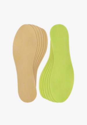 Zolen in twee kleuren: zeven beige met een gestructureerd oppervlak en drie felgroene. Iedere zool heeft een afgeronde vorm voor voetcomfort.