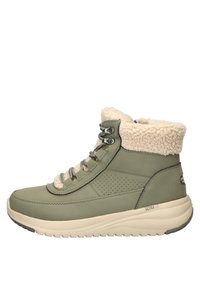 Groene waterdichte enkelboot met bontvoering, metalen oogjes en een gemêleerd ontwerp. De gevoerde zool verhoogt het comfort en de ondersteuning.