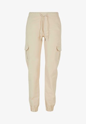 Pantaloni cargo beige con cintura elastica, chiusura con cordino e due tasche laterali. Tessuto liscio con polsini elasticizzati alle caviglie.