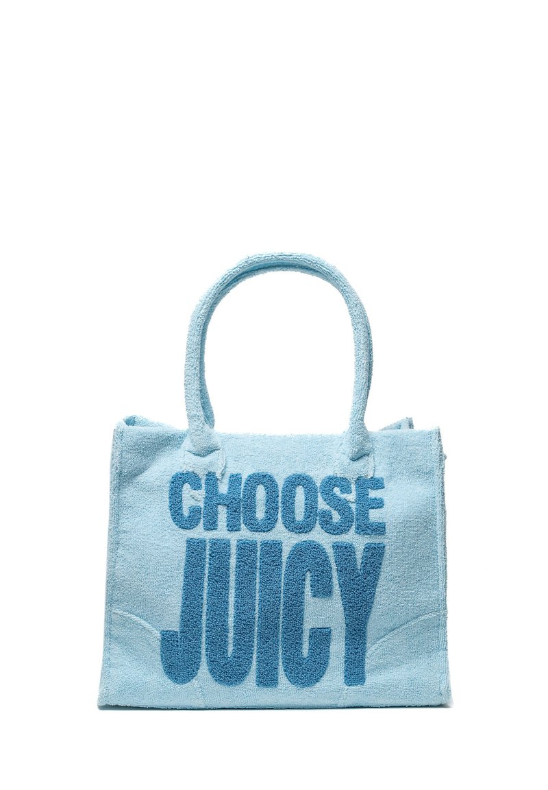 Ljusblå handdukstyg väska med texten "VÄLJ SAAFTIG" i fet blå stil. Rundade handtag och en strukturerad form med sydda kanter.