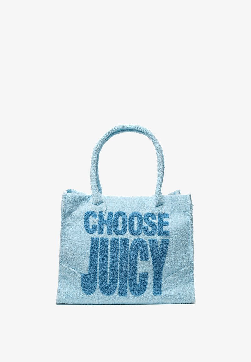 Ljusblå handdukstyg väska med texten "VÄLJ SAAFTIG" i fet blå stil. Rundade handtag och en strukturerad form med sydda kanter.