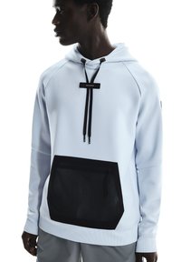 Light blue hoodie with a black mesh pocket, drawstrings, and a smooth texture. Features a modern cut and contrasting color accents.