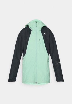 Lightweight, color-blocked jacket with mint green and black panels. Features a hood, zippered pockets, and reflective accents.