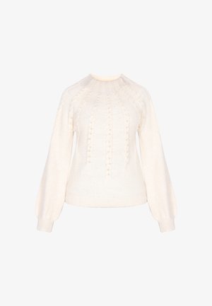 Vaaleanbeige neulepaita, jossa on pyöreä kaula-aukko, palmikkokuvioita ja puffihihat. Kangas näyttää pehmeältä ja siinä on teksturoitu pinta.