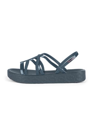 Dunkelblaue Sandalen mit einer strukturierten Sohle, die über kreuzende, durchsichtige Riemen und einen flexiblen Fersenriemen verfügen. Auffälliges Logo-Acccent.
