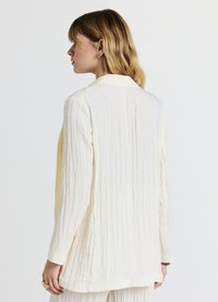 Calliope CRINKLE TINTA UNITA - Pantaloni - ecru chiaro