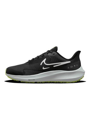 Chaussure de course Nike noir et blanc avec semelle verte, design swoosh en couches et icônes météo sur le côté, vue de profil gauche.