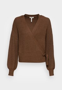 Pull marron enveloppant en tissu tricot côtelé. Comprend des manches longues, un col en V et un détail noué sur le côté à la taille.