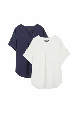 Two short-sleeve blouses, one navy blue and one white, with V-necklines and button-tab rolled sleeves, displayed on a white background.