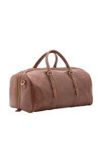Sac de voyage en cuir marron avec doubles poignées, fermeture à glissière et coutures décoratives. Texture lisse avec des accents métalliques et une forme ronde.