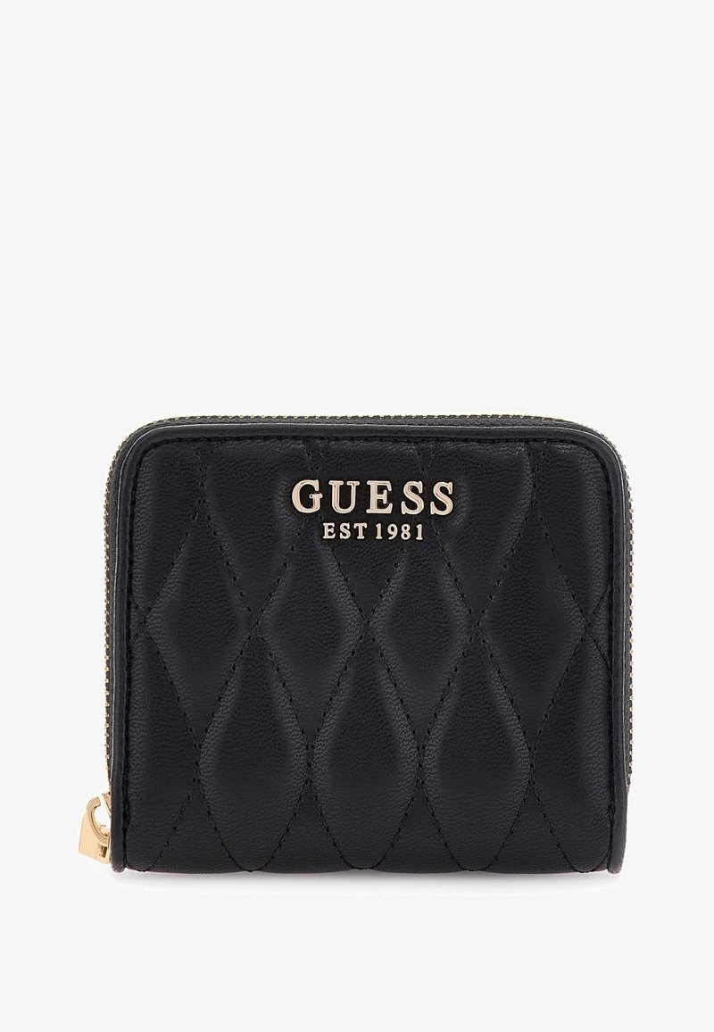 Black quilted leather wallet with gold zipper and GUESS EST 1981 logo embossed on front center.