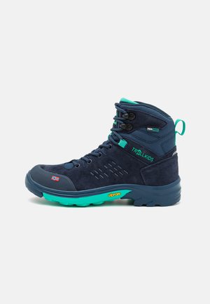 Navy hiking boot with teal accents, suede and synthetic upper, cushioned collar, lace-up design, and Vibram sole for traction.