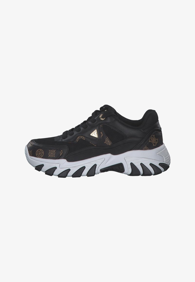 Zapatilla deportiva negra con un upper texturizado que presenta un sutil patrón marrón. Suela gruesa blanca y negra con acentos curvados y logo.