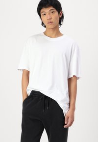 Hollister Co. Relaxed Fleece Joggers - Tracksuit bottoms - black beauty