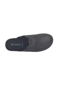 Scarpa tipo zoccolo nera realizzata in pelle testurizzata, con un bordo cucito ondulato, soletta morbida e design della punta arrotondata.