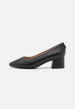 Black leather pump with a pointed toe and a moderate block heel. Smooth texture with a simple design and minimal hardware details.