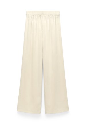 Szerokie spodnie z miękkiej beżowej tkaniny, z wygodnym elastycznym pasem i gładką, płynną fakturą.
