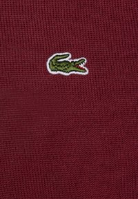 Lacoste Neule - zin