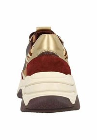 Chunky sneaker featuring a maroon suede heel, gold accents, textured brown mesh, and a thick white sole with purple detailing.