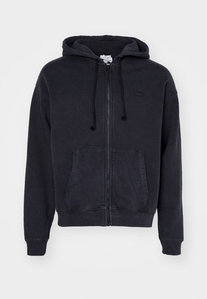 Donkergrijze ritshoodie van zacht katoen, met een voorzak en een verstelbare capuchon met trekkoord. Lacoste-logo op de borst.