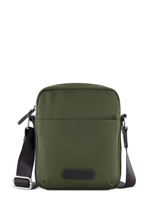 Olive green fabric crossbody bag with a sleek rectangular shape, adjustable strap, front pocket, and leather logo patch.