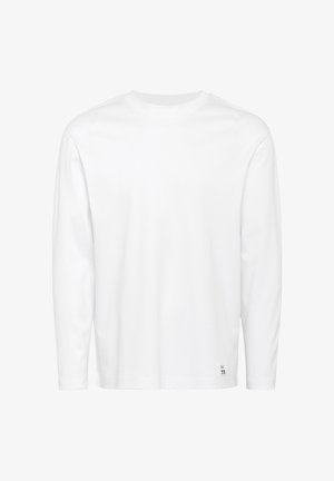 Biela dlhá rukávová tričko s okrúhlym výstrihom, na pravej strane pri spodnom leme je malá etiketa s označením "73".