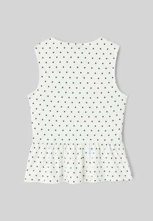 Blouse blanche sans manches à pois noirs avec un ourlet bas plissé en peplum, vue de dos sur un fond gris.