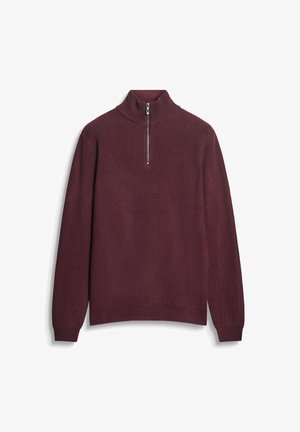 Maglione a maglia bordeaux con colletto alto, chiusura frontale con zip a metà, texture a coste e maniche lunghe. Presenta un orlo aderente nella parte inferiore.