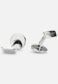 Silver cufflinks with a curved design, featuring a circular base and a rectangular top engraved with "HACKETT LONDON." Smooth, polished finish.