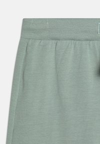 Lindex TROUSERS SQUIRREL AT BACK - Püksid - light dusty green