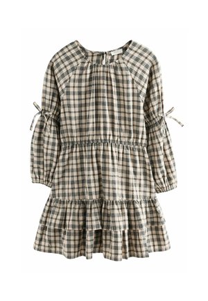 Robe à manches longues à carreaux beige et noire avec jupe à volants, taille froncée et liens aux manches.