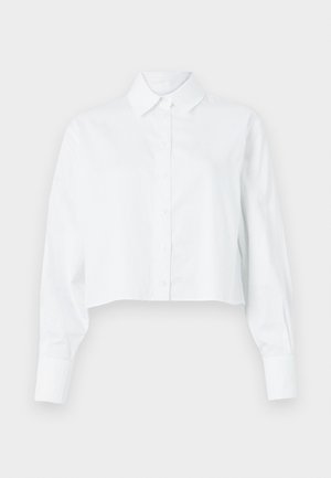 Fehér, felvágott, gombos ing hosszú ujjal, klasszikus gallérral és sima textúrával. Elöl gombos záródása van, és testre szabott fazonnal rendelkezik.