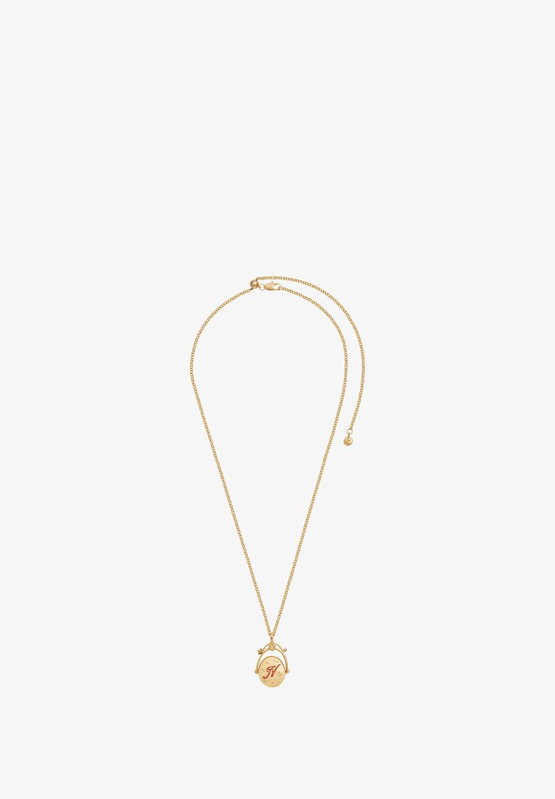 Collana in oro con pendente ovale, caratterizzato da una lettera "N" rossa e delicate decorazioni. La catena è fine e regolabile in lunghezza.
