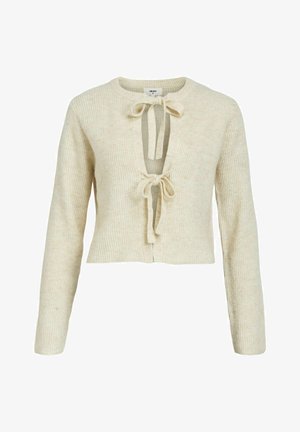 Bežani rebrasti pulover s dugim rukavima, skraćenim dizajnom i dubokim V-izrezom s dva prednja čvora. Mekani materijal i pletena struktura.