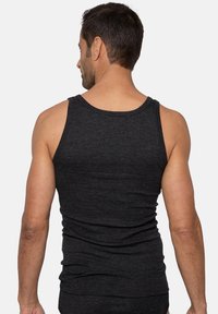 Black ribbed tank top featuring a rounded neckline and fitted design, made of lightweight fabric, with visible texture and close-fitting style.