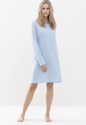 Light blue long-sleeve nightdress made of soft fabric, featuring a dotted pattern and a relaxed fit that falls above the knees.