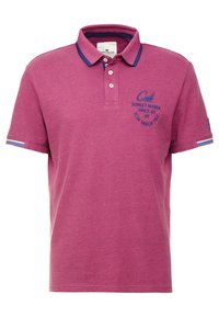 Kortärmad polo med krage i lila med marinblå detaljer, som har broderad text och randiga detaljer på ärmarna. Mjuk bomullsmaterial.