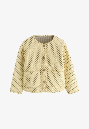 Gelbe gesteppte Jacke mit schwarzen Punkten, rundem Ausschnitt, Knöpfen vorne, zwei Vordertaschen und gestreiftem Innenfutter.