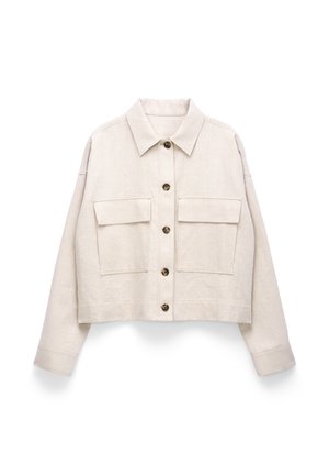 Beige cropped jacket with long sleeves, button-front closure, two flap chest pockets, and a pointed collar.