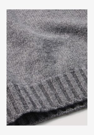 Grau gestrickter Stoff mit einer weichen Textur, der einen gerippten Saum aufweist. Das Material ist leicht und weist ein dezentes Muster auf.