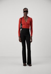 Vero Moda Tall VMAUGUSTA SLIM FLARED - Nohavice - black