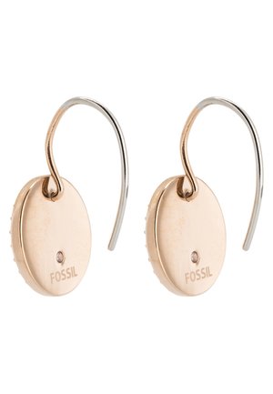 Orecchini ovali in oro rosa con finitura lucida, dotati di un gancio in argento e un piccolo dettaglio in cristallo. Marchio "FOSSIL" in evidenza.