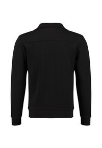 Sudadera negra de manga larga con puños y dobladillo acanalados, vista desde la parte de atrás, diseño liso con una costura en la parte superior de la espalda.