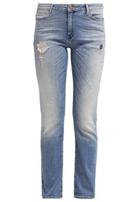 Vaaleansiniset farkut slim fit -mallilla, joissa on distressed-yksityiskohtia etupuolella, mukaan lukien repeämiä ja haalistumia jaloissa.