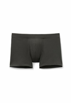 Tmavě šedé boxerky z měkké látky, s přiléhavým střihem a tvarovaným předním dílem. Hladké švy bez viditelných vzorů nebo kovových částí.